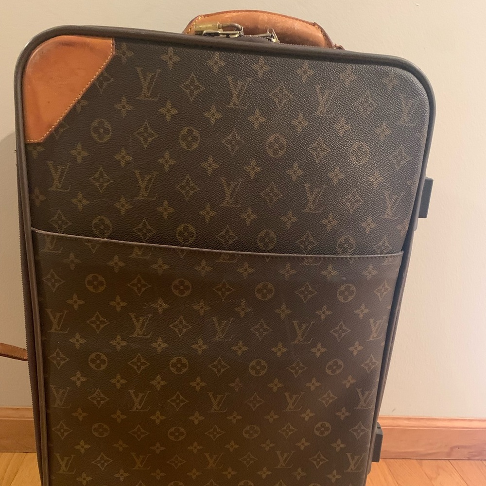 Louis Vuitton carryon roller suitcase.